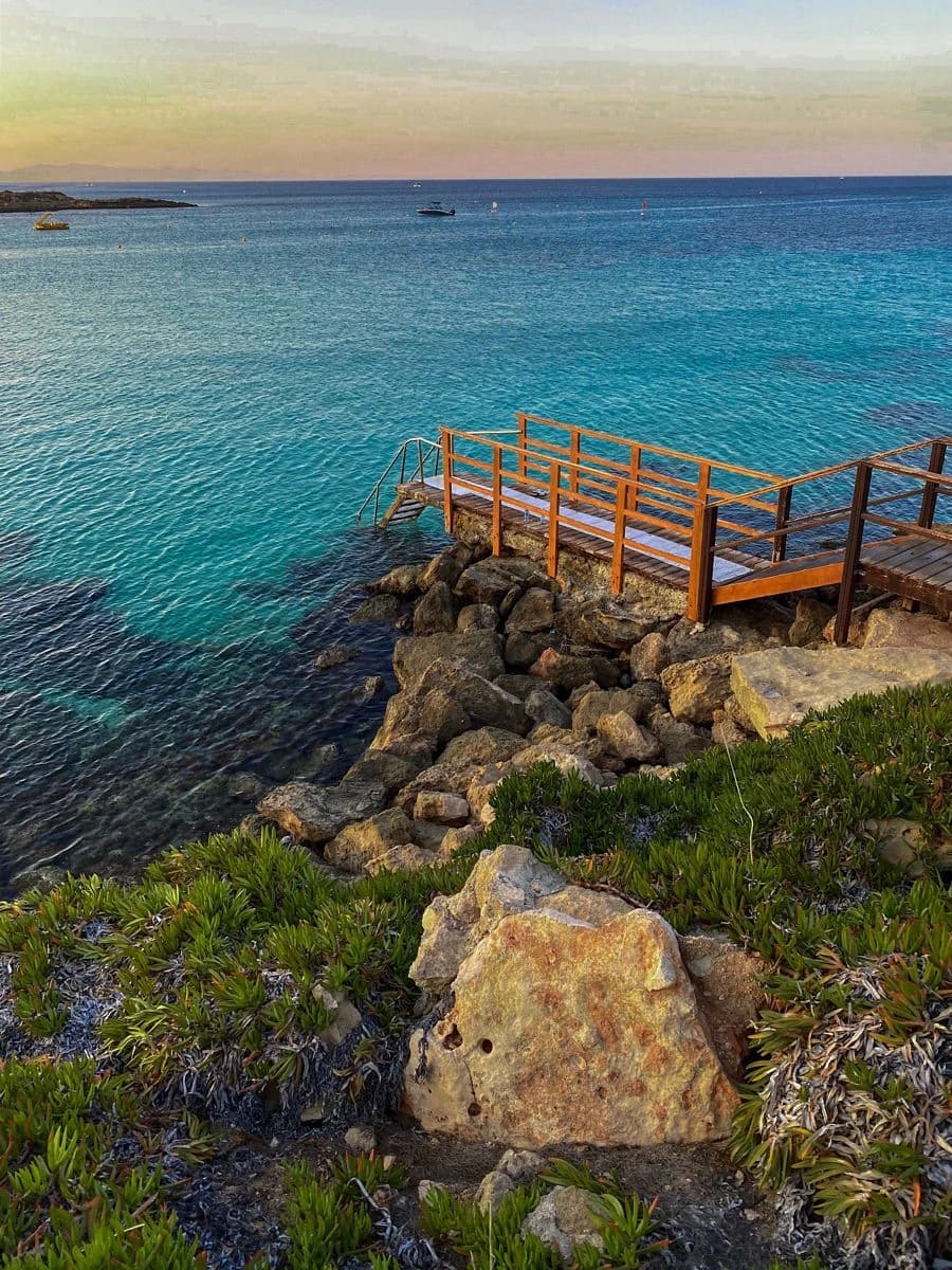 Wooden jetty over turquoise water
