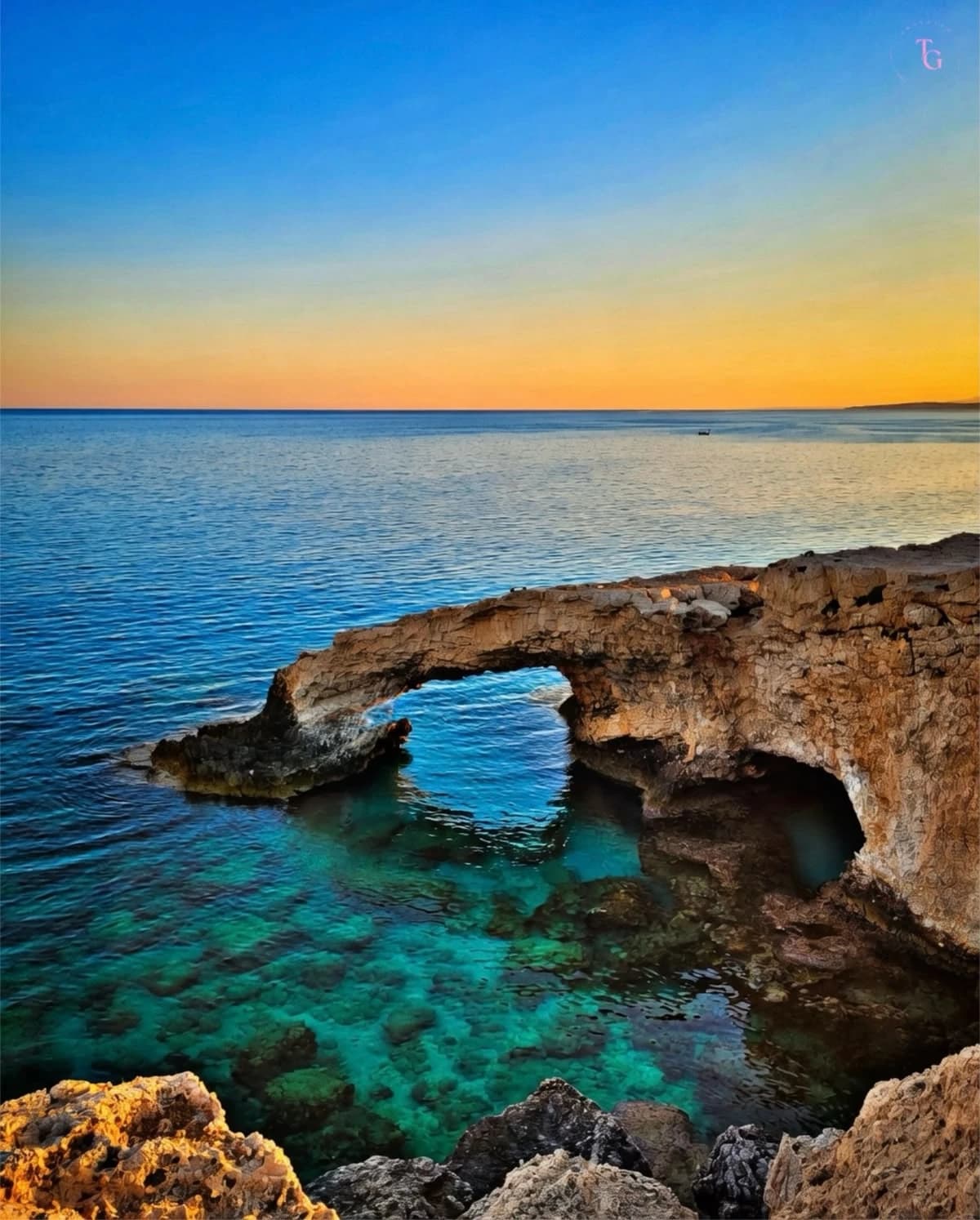 Sea arch over turquoise water, Cape Greco