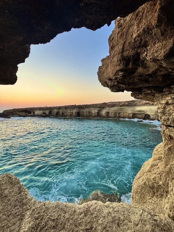 View out through the sea caves at Cape Greco